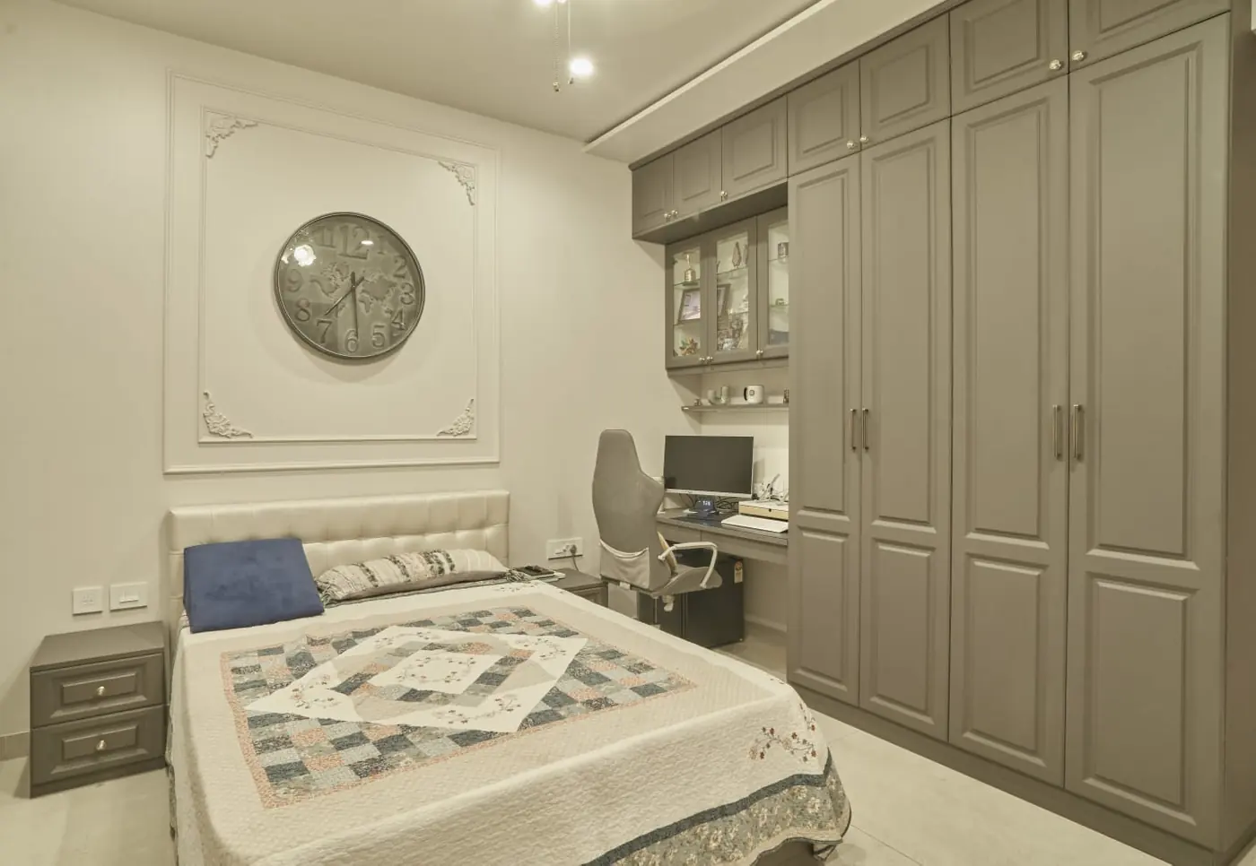 Grey shaker wardrobe with built-in study table in a Pune bedroom