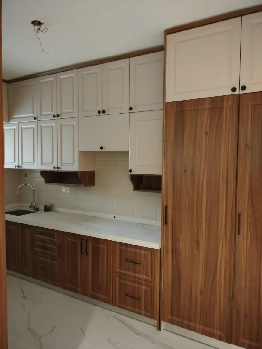 Walnut wood-finish and white modular kitchen with tall unit, Pune
